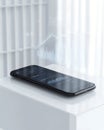 Minimalistic smartphone on a white surface showcasing futuristic data visualization and digital holographic graphics