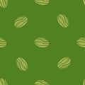 Minimalistic style seamless pattern with simple abstract watermelon elements. Green background