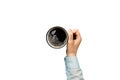 Minimalistic style woman hand holding a cup of coffee on Colored background. Flat lay, top view cappuccino cup. Empty