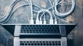 Minimalistic view of internet wires connected to a laptop concept of technology, connectivity, data transfer, and Royalty Free Stock Photo