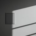 A minimalistic wall features a square panel, possibly an electrical outlet or light switch Royalty Free Stock Photo