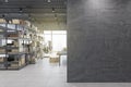 Minimalistic warehouse interior with empty mock up place on wall, racks, boxes, city view and daylight. Logistics and shipping