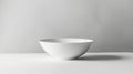 Minimalistic white ceramic bowl with subtle pattern on grey background, elegance in simplicity concept Royalty Free Stock Photo
