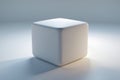 Minimalistic white cube with soft lighting on a smooth surface in a modern studio setting Royalty Free Stock Photo