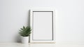 Minimalistic White Picture Frame Mockup With Plant