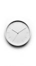 A minimalistic white wall clock with simple markings and hands displaying a specific time, casting a soft shadow on a white Royalty Free Stock Photo