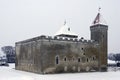 Minimalistic winter landscape. Old castle on a background of snow. January, Estonia, Saaremaa, Kuressaare