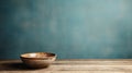 Minimalistic Wooden Table With Empty Bowl On Blue Wall