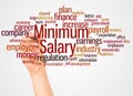 Minimum salary word cloud and hand with marker concept Royalty Free Stock Photo