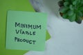 Minimum Viable Product write on a paperwork isolated on Wooden Table Royalty Free Stock Photo
