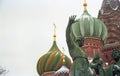 Minin and Pozharsky monument and famous Saint Basil`s Cathedral on Red Square, Moscow, Russia. Retro capture on film Royalty Free Stock Photo