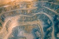 Mining from above. Industrial terraces on open pit mineral mine. Aerial view of opencast mining. Dolomite Mine Excavation.