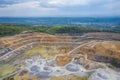 Mining from above. Industrial terraces on open pit mineral mine. Aerial view of opencast mining. Dolomite Mine Excavation.