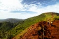 Mining construction workers surveying mountain top in Africa Royalty Free Stock Photo