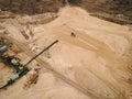 Mining conveyor at sand quarry. Aerial view of mining machinery Royalty Free Stock Photo