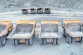 Mining dump trucks are parked in row. Equipment for an industria Royalty Free Stock Photo