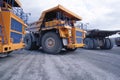 Mining dump trucks are parked in row. Equipment for an industrial quarry Royalty Free Stock Photo