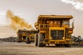 Mining dump trucks transporting Platinum ore for processing