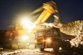 Mining. excavator loading granite or ore into dump truck Royalty Free Stock Photo