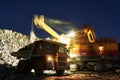 Mining. excavator loading granite or ore into dump truck Royalty Free Stock Photo