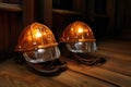 mining helmets with headlamps placed on a wooden table