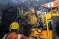 Mining operator on mining machine, underground mine mesh. Royalty Free Stock Photo