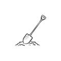 Mining shovel in rock hand drawn outline doodle icon