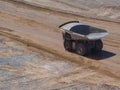 Mining truck traveling on mine haul road Royalty Free Stock Photo
