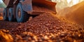 Mining truck unloading minerals at sunset in open pit mine Royalty Free Stock Photo