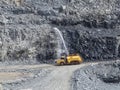 Mining water cart wetting washing walls. Royalty Free Stock Photo