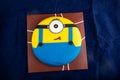 Minion Cake served on board isolated on napkin side view of cafe baked food