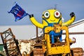 Minion on a Tractor Holding a Trump Flag