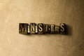 MINISTERS - close-up of grungy vintage typeset word on metal backdrop