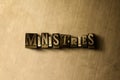 MINISTRIES - close-up of grungy vintage typeset word on metal backdrop