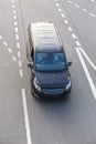 minivan moves on urban multi-lane road Royalty Free Stock Photo