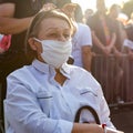 Old woman in protective mask in the park Royalty Free Stock Photo