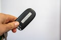 Woman hand holds a Jeep key fob remote for her SUV vehicle Royalty Free Stock Photo