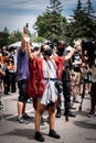 Black Lives Matter protestor lifting hands in prayer for George Floyd Family Memorial Service after Minneapolis riots