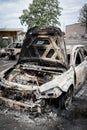 Burned down damaged car in the morning after looting and minneapolis riots for George Floyd protests Royalty Free Stock Photo