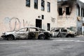 Burned down damaged cars in the morning after looting and minneapolis riots for George Floyd protests