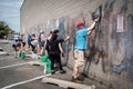 Volunteer to clean up graffiti of local school after looting and minneapolis riots for George Floyd in Black Lives Matter protests Royalty Free Stock Photo