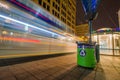 Long exposure at night of a Minneapolis Minnesota MetroTransit bus speeding by a bus shelter on