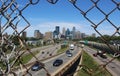 Minneapolis Skyline through a Chain link Fence