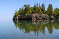 Small island on the Minnesota North Shore reflecting in lake