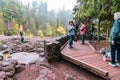 Crowds of tourists gather on boardwalk overlook to see Gooseberry Falls waterfall at the state