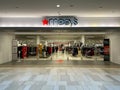 Entrance to a Macys store inside of a mall, sellling clothing, home goods, shoes and