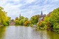 Minnewater castle at the Lake of Love during fall, Bruges, Belgium Royalty Free Stock Photo