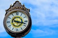 Minocqua Wisconsin Clock with Blue Cloudy Sky