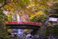 Minoo Waterfall in Colorful Autumn Season with Red Maple Leaf Fall Foliage and Beautiful Red Bridge. Royalty Free Stock Photo