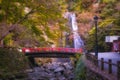 Minoo Waterfall in Colorful Autumn Season with Red Maple Leaf Fall Foliage and Beautiful Red Bridge. Royalty Free Stock Photo